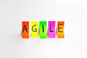 Depositphotos_81381430_m-2015 Image inscriptions of agile. Agile methodology writing colors stickers isolated on white background of white board.